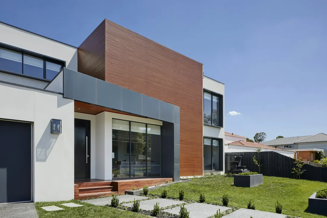 The exterior grounds and lawn of a contemporary house.